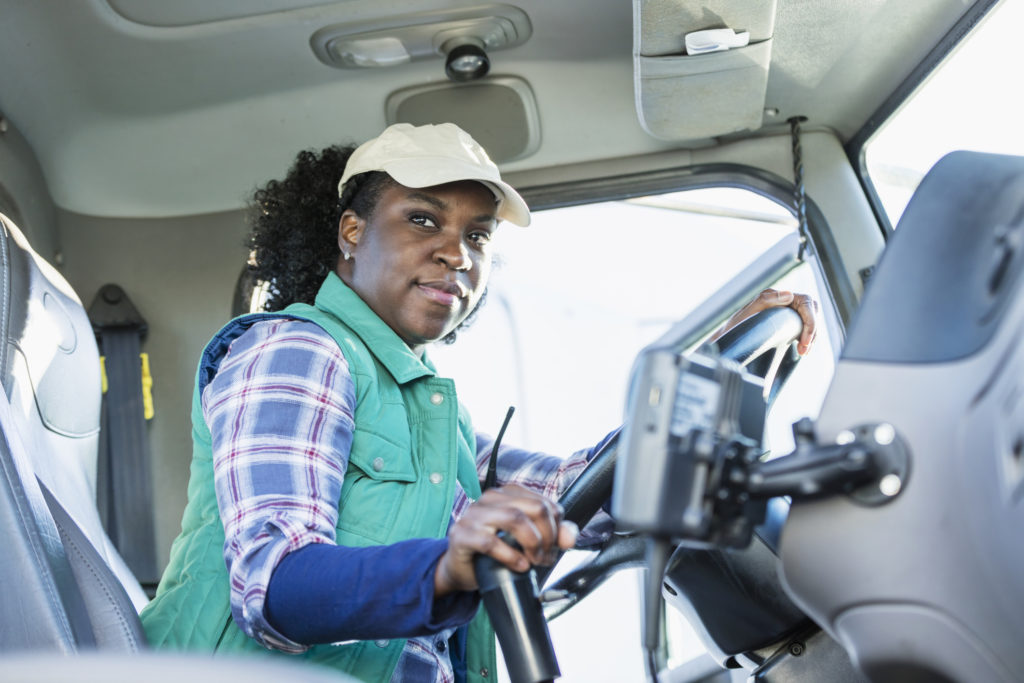 African-American woman driving a semi-truck